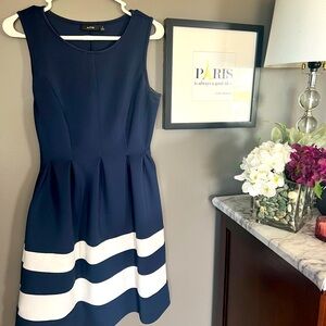 Apt 9 navy blue sleeveless dress with a white trim detail on the bottom. Size M